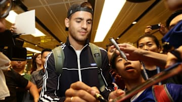 SINGAPORE - JULY 22: Alvaro Morata of Chelsea FC (C) signs autograph for fans after he arrives at Changi International Airport ahead of the International Champions Cup on July 22, 2017 in Singapore. (Photo by Suhaimi Abdullah/Getty Images for ICC)