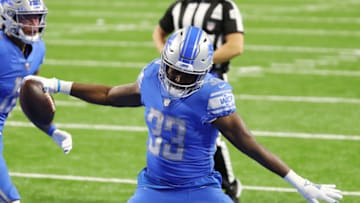 DETROIT, MICHIGAN - DECEMBER 13: Kerryon Johnson #33 of the Detroit Lions celebrates scoring a touchdown during the fourth quarter against the Green Bay Packers at Ford Field on December 13, 2020 in Detroit, Michigan. (Photo by Rey Del Rio/Getty Images)