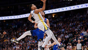 Apr 21, 2022; Denver, Colorado, USA; Golden State Warriors guard Jordan Poole (3) drives to the net against Denver Nuggets guard Bryn Forbes (6) in the third quarter during game three of the first round of the 2022 NBA playoffs at Ball Arena. Mandatory Credit: Isaiah J. Downing-USA TODAY Sports