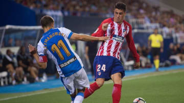 LEGANES, SPAIN - SEPTEMBER 30: Jose Maria Gimenez of Club Atletico de Madrid is tackled by Alexander Szymanowski of CD Leganes during the La Liga match between Leganes and Atletico Madrid at Estadio Municipal de Butarque on September 30, 2017 in Leganes, Spain. (Photo by Denis Doyle/Getty Images)