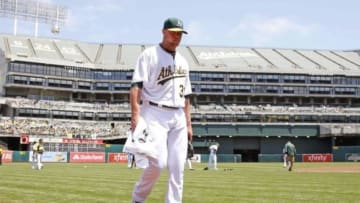 Aug 2, 2014; Oakland, CA, USA; Oakland Athletics starting pitcher Jon Lester (31) comes off the field after warming up before the game against the Kansas City Royals at O.co Coliseum. Mandatory Credit: Bob Stanton-USA TODAY Sports
