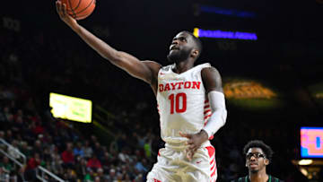 Feb 25, 2020; Fairfax, Virginia, USA; Dayton Flyers guard Jalen Crutcher (10) shoots as George Mason Patriots forward AJ Wilson (12) looks on during the first half at EagleBank Arena. Mandatory Credit: Brad Mills-USA TODAY Sports