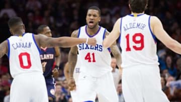 Mar 7, 2015; Philadelphia, PA, USA; Philadelphia 76ers forward Thomas Robinson (41) reacts with forward Furkan Aldemir (19) and guard Isaiah Canaan (0) after a score against the Atlanta Hawks during the second half at Wells Fargo Center. Mandatory Credit: The 76ers won 92-84. Bill Streicher-USA TODAY Sports