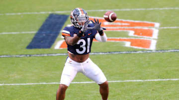 CHARLOTTESVILLE, VA - NOVEMBER 21: Shane Simpson #31 of the Virginia Cavaliers warms up before the start of a game against the Abilene Christian Wildcats at Scott Stadium on November 21, 2020 in Charlottesville, Virginia. (Photo by Ryan M. Kelly/Getty Images)