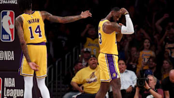 LOS ANGELES, CA - OCTOBER 02: LeBron James #23 of the Los Angeles Lakers celebrates his dunk in front of Brandon Ingram #14 during a preseason game against the Denver Nuggets at Staples Center on October 2, 2018 in Los Angeles, California. (Photo by Harry How/Getty Images)