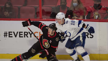 Nov 6, 2021; Ottawa, Ontario, CAN; Ottawa Senators left wing Brady Tkachuk (7) battles with Tampa Bay Lightning left wing Ondrej Palat (18) in the third period at the Canadian Tire Centre. Mandatory Credit: Marc DesRosiers-USA TODAY Sports