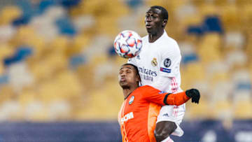 KHARKOV, UKRAINE - DECEMBER 01: Mateus Cardoso Tete of Shakhtar (L) is challenged by Ferland Mendy of Real Madrid (R) during the UEFA Champions League Group B stage match between Shakhtar Donetsk and Real Madrid at Metalist Stadium on December 1, 2020 in Kharkov, Ukraine. (Photo by Ricardo Nogueira/Eurasia Sport Images/Getty Images)