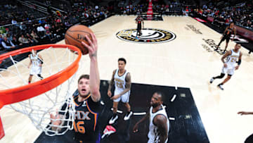 ATLANTA, GA - FEBRUARY 23: Tyler Johnson #16 of the Phoenix Suns shoots the ball against the Atlanta Hawks on February 23, 2019 at State Farm Arena in Atlanta, Georgia. NOTE TO USER: User expressly acknowledges and agrees that, by downloading and/or using this Photograph, user is consenting to the terms and conditions of the Getty Images License Agreement. Mandatory Copyright Notice: Copyright 2019 NBAE (Photo by Scott Cunningham/NBAE via Getty Images)