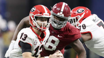 Dec 4, 2021; Atlanta, GA, USA; Alabama defensive lineman Phidarian Mathis (48) pressures Georgia quarterback Stetson Bennett (13) during the SEC championship game at Mercedes-Benz Stadium. Mandatory Credit: Gary Cosby Jr.-USA TODAY Sports