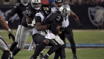 Aug 4, 2022; Canton, Ohio, USA; Jacksonville Jaguars linebacker Travon Walker (44) sacks Las Vegas Raiders quarterback Jarrett Stidham (3) in the first quarter in the 2022 Hall of Fame game at Tom Benson Hall of Fame Stadium. Mandatory Credit: Ken Blaze-USA TODAY Sports