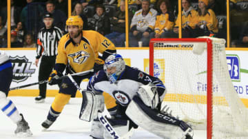 NASHVILLE, TN - MARCH 13: Nashville Predators center Mike Fisher (12) and Winnipeg Jets goalie Connor Hellebuyck (37) are shown during the overtime session of the NHL game between the Nashville Predators and the Winnipeg Jets, held on March 13, 2017, at Bridgestone Arena in Nashville, Tennessee. (Photo by Danny Murphy/Icon Sportswire via Getty Images)