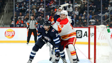 Winnipeg Jets, Brenden Dillon (5), Calgary Flames, Matthew Tkachuk (19). Mandatory Credit: Terrence Lee-USA TODAY Sports