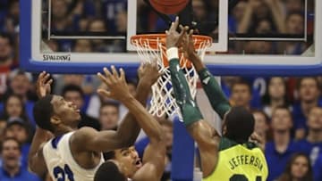 Jan 20, 2014; Lawrence, KS, USA; Kansas Jayhawks center Joel Embiid (21) and Baylor Bears forward Cory Jefferson (34) fight for a rebound during the second half at Allen Fieldhouse. Kansas won 78-68. Mandatory Credit: Denny Medley-USA TODAY Sports