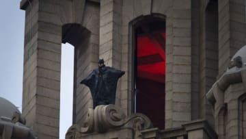 LIVERPOOL, ENGLAND - OCTOBER 15: A stunt man dressed as Batman stands on a ledge near the top of the Liver Building during filming rehearsals for the latest The Batman film on October 15, 2020 in Liverpool, United Kingdom. Filming is taking place all this week amid new Covid regulations in the city. The Batman is an upcoming American superhero film based on the DC Comics character of the same name. Produced by DC Films and distributed by Warner Bros. Pictures, it is a reboot of the Batman film franchise directed by Matt Reeves and starring Robert Pattinson. (Photo by Colin McPherson/Getty Images)