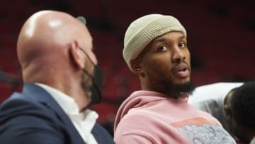 Jan 5, 2022; Portland, Oregon, USA; Portland Trail Blazers guard Damian Lillard (0) sits on the team bench before a game against the Miami Heat at Moda Center. Mandatory Credit: Troy Wayrynen-USA TODAY Sports
