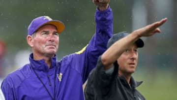 Aug 1, 2016; Mankato, MN, USA; Minnesota Vikings head coach Mike Zimmer (left) gestures with head athletic trainer Eric Sugarman (right) during a weather delay at training camp session at Minnesota State University. Mandatory Credit: Bruce Kluckhohn-USA TODAY Sports