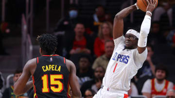 ATLANTA, GEORGIA - MARCH 11: Reggie Jackson #1 of the Los Angeles Clippers looks to pass against Clint Capela #15 of the Atlanta Hawks during the first half at State Farm Arena on March 11, 2022 in Atlanta, Georgia. NOTE TO USER: User expressly acknowledges and agrees that, by downloading and or using this photograph, User is consenting to the terms and conditions of the Getty Images License Agreement. (Photo by Kevin C. Cox/Getty Images)