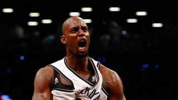 NEW YORK, NY - APRIL 25: (NEW YORK DAILIES OUT) Kevin Garnett #2 of the Brooklyn Nets reacts after winning a battle for a loose ball against the Toronto Raptors in Game Three of the Eastern Conference Quarterfinals during the 2014 NBA Playoffs at Barclays Center on April 25, 2014 in the Brooklyn borough of New York City.The Nets defeated the Raptors 102-98 for a two games to one lead in the best of seven series. NOTE TO USER: User expressly acknowledges and agrees that, by downloading and/or using this Photograph, user is consenting to the terms and conditions of the Getty Images License Agreement. (Photo by Jim McIsaac/Getty Images)