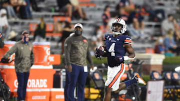 Auburn football running back Tank Bigsby (4) wamrs up ahead of the Tennessee game at Jordan-Hare Stadium in Auburn, Ala., on Saturday, Nov. 21, 2020.Auburn Ut
