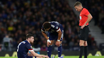 GLASGOW, SCOTLAND - NOVEMBER 15: Andy Robertson of Scotland reacts as he looks to be injured during the 2022 FIFA World Cup Qualifier match between Scotland and Denmark at Hampden Park on November 15, 2021 in Glasgow, Scotland. (Photo by Ian MacNicol/Getty Images)