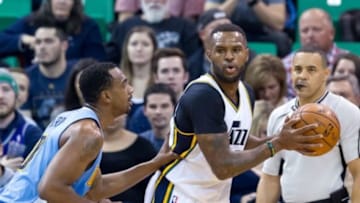 Dec 18, 2015; Salt Lake City, UT, USA; Denver Nuggets forward Darrell Arthur (00) defends against Utah Jazz forward Trevor Booker (33) during the first half at Vivint Smart Home Arena. Mandatory Credit: Russ Isabella-USA TODAY Sports