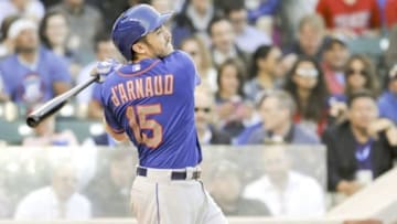 New York Mets catcher Travis d'Arnaud (15) swings against the Chicago Cubs at Wrigley Field. Mandatory Credit: Matt Marton-USA TODAY Sports