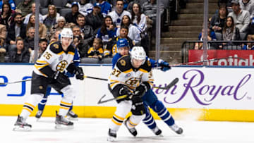 TORONTO, ON - NOVEMBER 15: John Tavares #91 of the Toronto Maple Leafs battles for the puck against Patrice Bergeron #37 of the Boston Bruins during the first period at the Scotiabank Arena on November 15, 2019 in Toronto, Ontario, Canada. (Photo by Mark Blinch/NHLI via Getty Images)