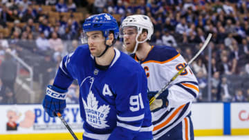 TORONTO, ON - FEBRUARY 27: John Tavares #91 of the Toronto Maple Leafs battles for position against Connor McDavid #97 of the Edmonton Oilers during the third period at the Scotiabank Arena on February 27, 2019 in Toronto, Ontario, Canada. (Photo by Kevin Sousa/NHLI via Getty Images)