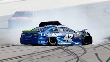 TALLADEGA, AL - OCTOBER 14: Kyle Larson, driver of the #42 Credit One Bank Chevrolet, spins on the backstretch during the Monster Energy NASCAR Cup Series 1000Bulbs.com 500 at Talladega Superspeedway on October 14, 2018 in Talladega, Alabama. (Photo by Brian Lawdermilk/Getty Images)