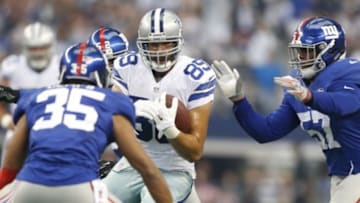 Oct 19, 2014; Arlington, TX, USA; Dallas Cowboys tight end Gavin Escobar (89) runs the ball after making a catch while being defended by New York Giants free safety Quintin Demps (35) and outside linebacker Jacquian Williams (57) at AT&T Stadium. Mandatory Credit: Tim Heitman-USA TODAY Sports