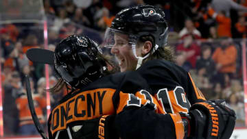 PHILADELPHIA, PENNSYLVANIA - FEBRUARY 16: Travis Konecny #11 of the Philadelphia Flyers is congratulated by Nolan Patrick #19 after Konecny scored the game winning goal in overtime at Wells Fargo Center on February 16, 2019 in Philadelphia, Pennsylvania.The Philadelphia Flyers defeated the Detroit Red Wings 6-5 in overtime. (Photo by Elsa/Getty Images)