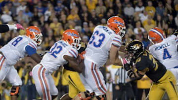 Oct 10, 2015; Columbia, MO, USA; Florida Gators running back Jordan Cronkrite (32) runs the ball as Missouri Tigers linebacker Michael Scherer (30) attempts the tackle during the second half at Faurot Field. Florida won 21-3. Mandatory Credit: Denny Medley-USA TODAY Sports