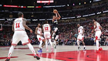 CHICAGO, ILLINOIS - MARCH 04: Giannis Antetokounmpo #34 of the Milwaukee Bucks shoots against (L-R) DeMar DeRozan #11, Derrick Jones Jr. #5, Ayo Dosunmu #12, Javonte Green #24 and Coby White #0 of the Chicago Bulls at the United Center on March 04, 2022 in Chicago, Illinois. The Bucks defeated the Bulls 118-112. NOTE TO USER: User expressly acknowledges and agrees that, by downloading and or using this photograph, User is consenting to the terms and conditions of the Getty Images License Agreement. (Photo by Jonathan Daniel/Getty Images)