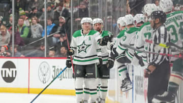 Mar 6, 2022; Saint Paul, Minnesota, USA; Dallas Stars defenseman John Klingberg (3) and team are congratulated on scoring on the empty net in the third period at Xcel Energy Center. Mandatory Credit: Matt Blewett-USA TODAY Sports