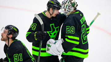Apr 23, 2022; Dallas, Texas, USA; Dallas Stars right wing Denis Gurianov (34) and goaltender Jake Oettinger (29) celebrate the win over the Seattle Kraken at the American Airlines Center. Mandatory Credit: Jerome Miron-USA TODAY Sports