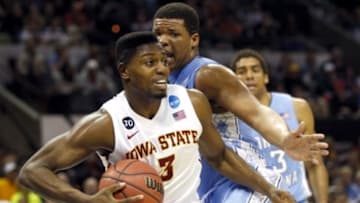 Mar 23, 2014; San Antonio, TX, USA; Iowa State Cyclones forward Melvin Ejim (3) drives against North Carolina Tar Heels forward Kennedy Meeks (3) in the second half of a men