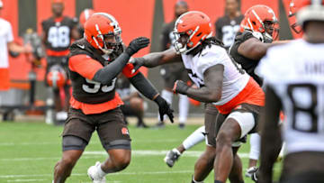 BEREA, OH - JULY 29: Offensive tackle James Hudson III #66 of the Cleveland Browns blocks defensive end Myles Garrett #95 during the second day of Cleveland Browns Training Camp on July 29, 2021 in Berea, Ohio. (Photo by Nick Cammett/Getty Images)