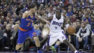 Dec 27, 2014; Sacramento, CA, USA; Sacramento Kings guard Darren Collison (7) dribbles the ball past New York Knicks guard Jose Calderon (3) in the third quarter at Sleep Train Arena. The Kings won 135-129 in overtime. Mandatory Credit: Cary Edmondson-USA TODAY Sports