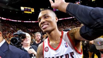 May 2, 2014; Portland, OR, USA; Portland Trail Blazers guard Damian Lillard (0) walks off the court after hitting the game winning shot against the Houston Rockets during the fourth quarter in game six of the first round of the 2014 NBA Playoffs at the Moda Center. Mandatory Credit: Craig Mitchelldyer-USA TODAY Sports