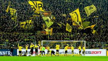 Dortmund, GERMANY - NOVEMBER 19: The yellow wall of supporters of Borussia Dortmund during the Bandesliga soccer match between BV Borussia Dortmund and FC Bayern Muenchen at the Signal Iduna Park in Dortmund, Germany on November 19, 2016. (Photo by TF-Images/Getty Images)