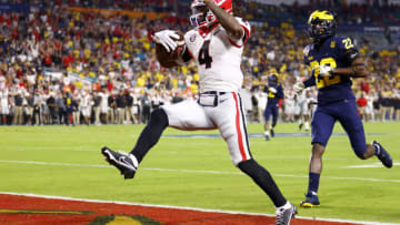 James Cook runs the ball into the end zone for a touchdown. (Photo by Michael Reaves/Getty Images)