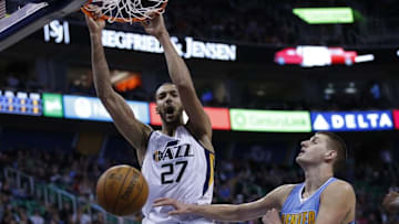 Nov 23, 2016; Salt Lake City, UT, USA; Utah Jazz center Rudy Gobert (27) dunks the ball in the third quarter against Denver Nuggets forward Nikola Jokic (15) at Vivint Smart Home Arena. The Utah Jazz defeated the Denver Nuggets 108-83. Mandatory Credit: Jeff Swinger-USA TODAY Sports
