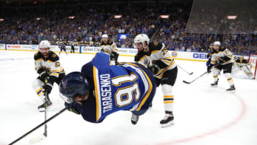 ST LOUIS, MISSOURI - JUNE 03: Vladimir Tarasenko #91 of the St. Louis Blues is flipped in the air in front of Sean Kuraly #52 and Connor Clifton #75 of the Boston Bruins during the third period of Game Four of the 2019 NHL Stanley Cup Final at Enterprise Center on June 03, 2019 in St Louis, Missouri. (Photo by Dave Sandford/NHLI via Getty Images)