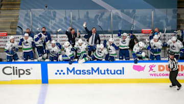 EDMONTON, ALBERTA - AUGUST 07: The Vancouver Canucks celebrate their 5-4 win on a goal by Christopher Tanev (not pictured) at :11 in overtime to defeat the Minnesota Wild in Game Four and the Western Conference Qualification Round prior to the 2020 NHL Stanley Cup Playoffs at Rogers Place on August 07, 2020 in Edmonton, Alberta. (Photo by Jeff Vinnick/Getty Images)