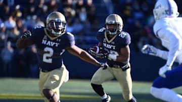 Nov 12, 2016; Annapolis, MD, USA; Navy Midshipmen running back Dishan Romine (28) rushes the ball as running back Toneo Gulley (2) blocks during the second half at Navy Marine Corps Memorial Stadium. Mandatory Credit: Brad Mills-USA TODAY Sports