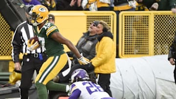 Dec 24, 2016; Green Bay, WI, USA; Green Bay Packers wide receiver Davante Adams (17) runs past Minnesota Vikings cornerback Trae Waynes (26) to score a touchdown in the first quarter at Lambeau Field. Mandatory Credit: Benny Sieu-USA TODAY Sports