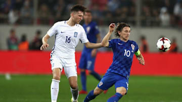 PIRAEUS, GREECE - NOVEMBER 12: Panagiotis Retsos of Greece and Luka Modric of Croatia in action during the FIFA 2018 World Cup Qualifier Play-Off: Second Leg between Greece and Croatia at Karaiskakis Stadium on November 12, 2017 in Piraeus, . (Photo by Catherine Ivill/Getty Images)