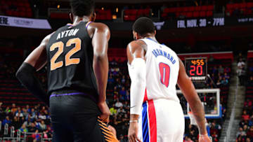 DETROIT, MI - NOVEMBER 25: Deandre Ayton #22 of the Phoenix Suns and Andre Drummond #0 of the Detroit Pistons stand on the court during the game on November 25, 2018 at Little Caesars Arena in Detroit, Michigan. NOTE TO USER: User expressly acknowledges and agrees that, by downloading and/or using this photograph, User is consenting to the terms and conditions of the Getty Images License Agreement. Mandatory Copyright Notice: Copyright 2018 NBAE (Photo by Chris Schwegler/NBAE via Getty Images)