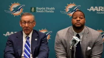 Mar 11, 2015; Davie, FL, USA; Miami Dolphins defensive tackle Ndamukong Suh (right) is flanked by Dolphins owner Stephen Ross (left) at Doctors Hospital Training Facility. Mandatory Credit: Steve Mitchell-USA TODAY Sports