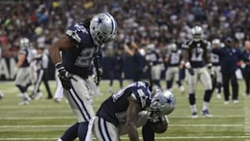 Sep 21, 2014; St. Louis, MO, USA; Dallas Cowboys cornerback Morris Claiborne (24) gives thanks after intercepting a pass during the second half against the St. Louis Rams at the Edward Jones Dome. The Cowboys defeated the Rams 34-31. Mandatory Credit: Jeff Curry-USA TODAY Sports